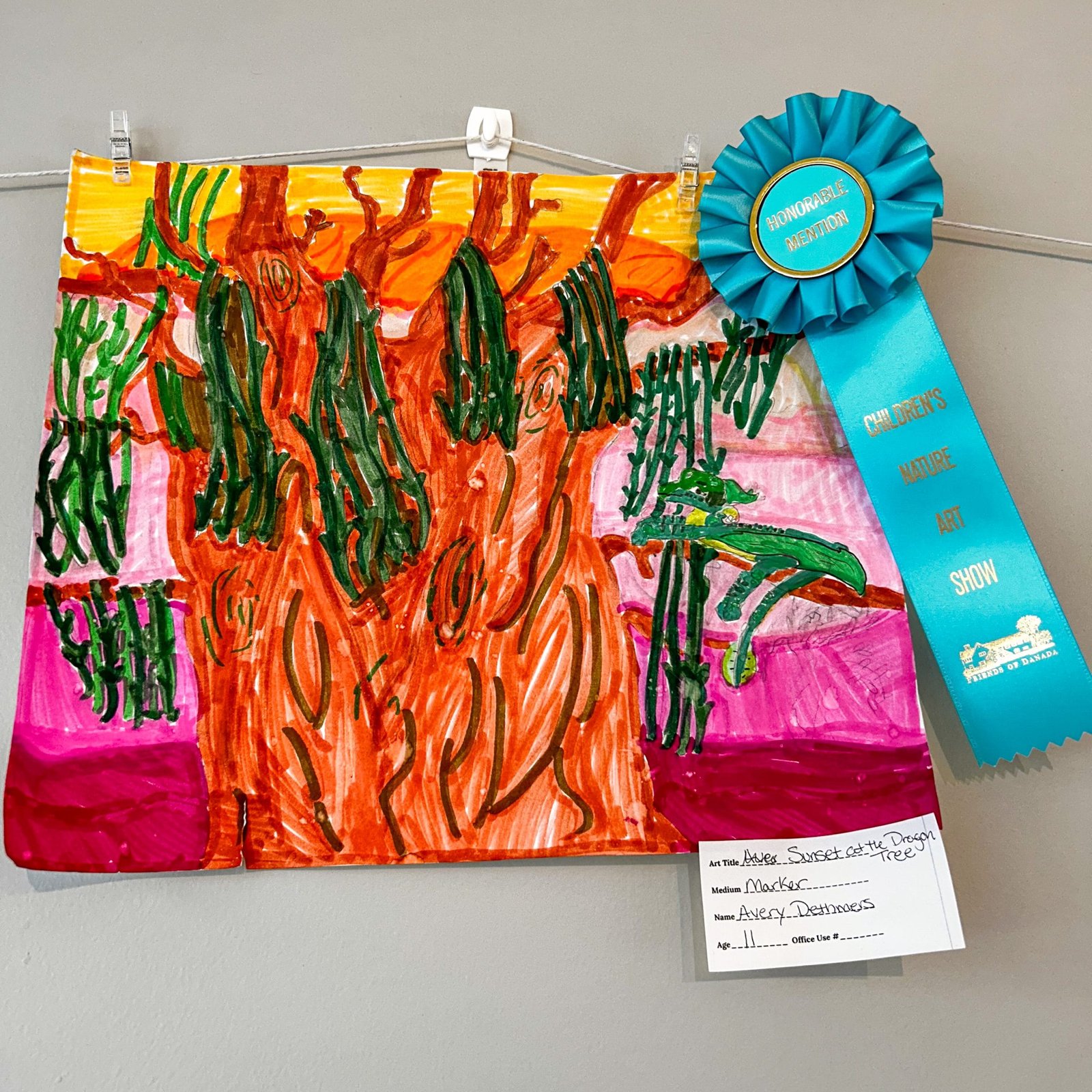 Adver sunset at the dragon tree marker artwork by avery dettmers age 11 with honorable mention ribbon