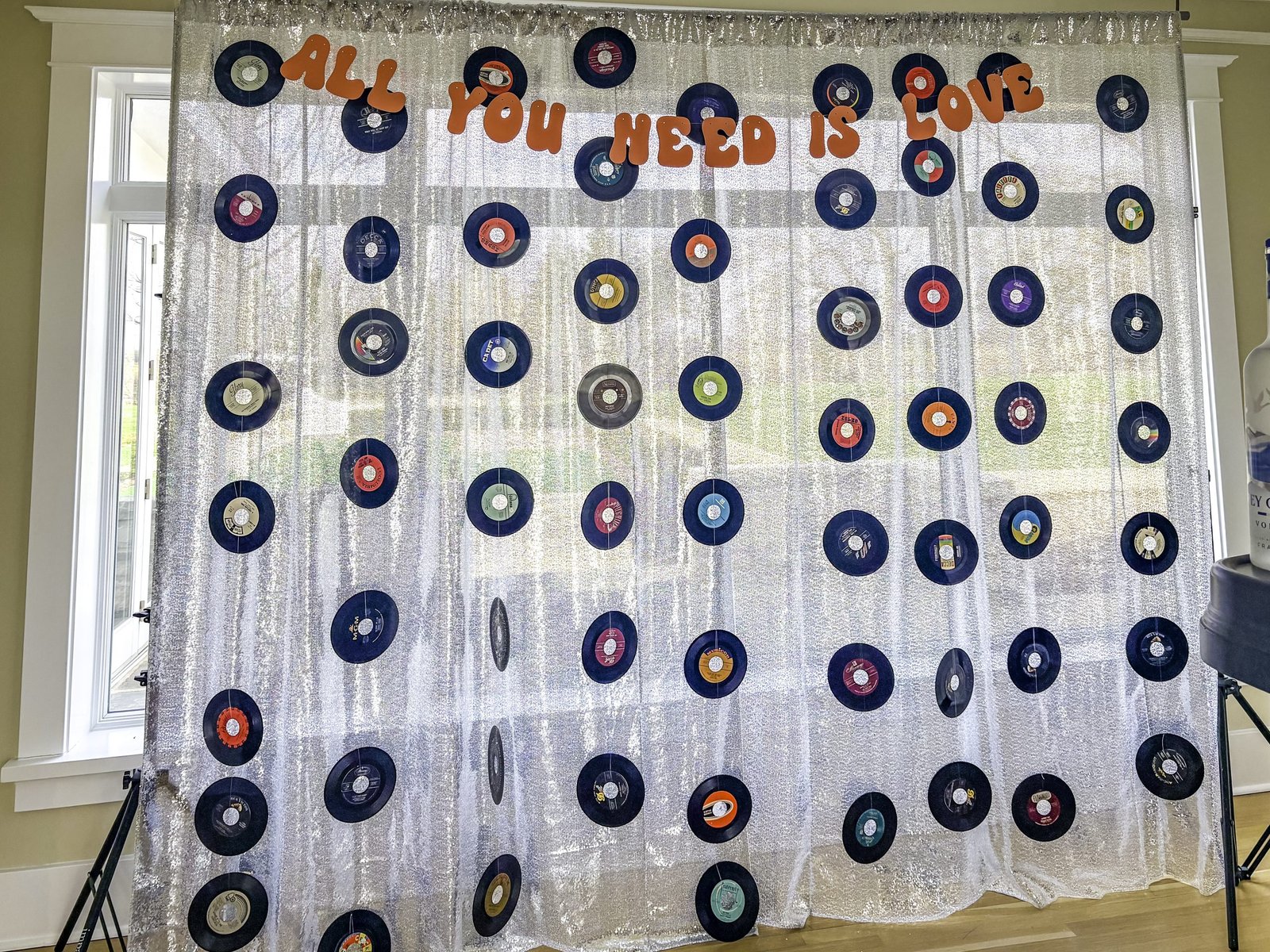 Table set with vinyl record centerpiece and fresh flowers