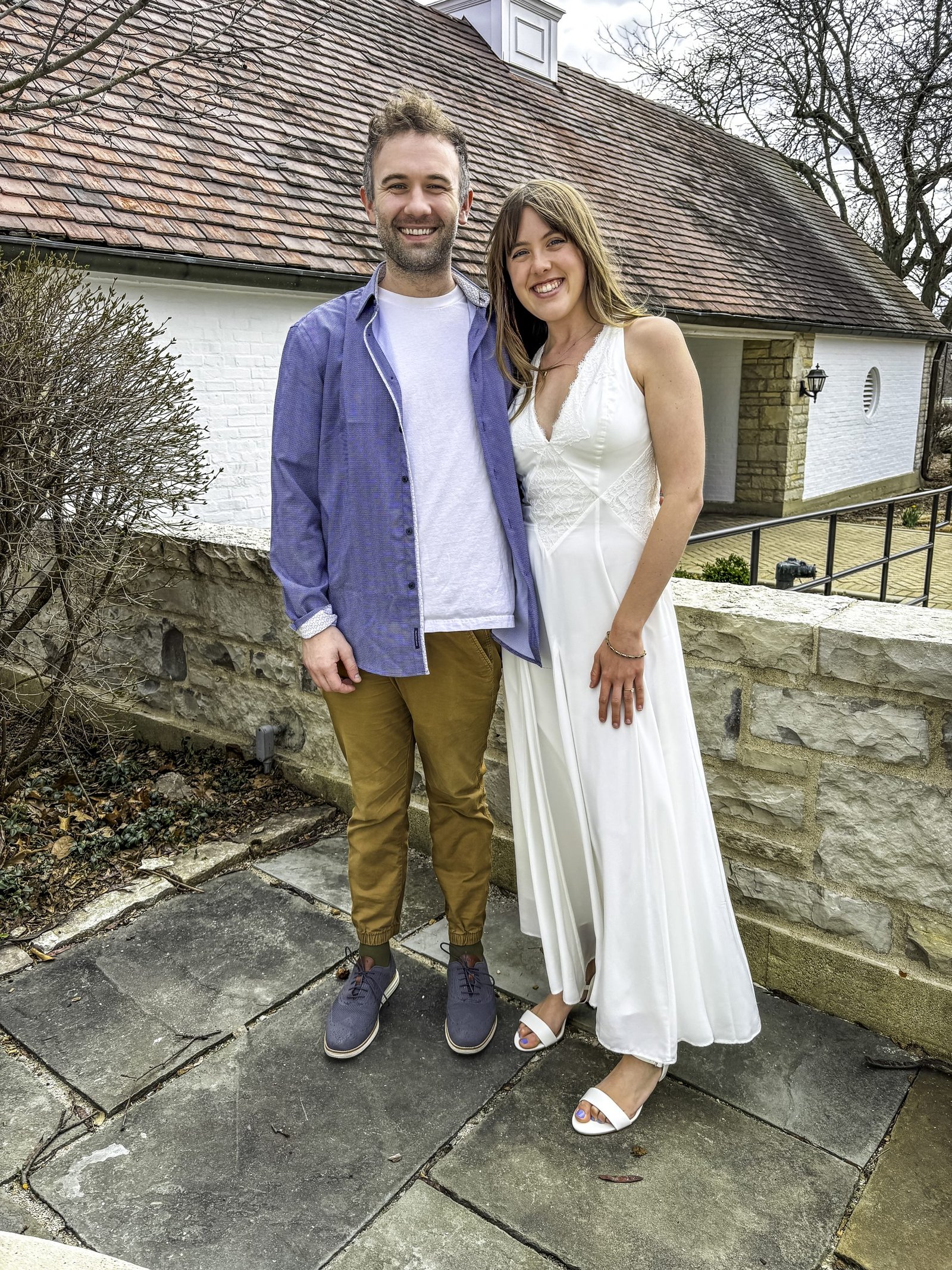 Happy couple smiling outside danada house