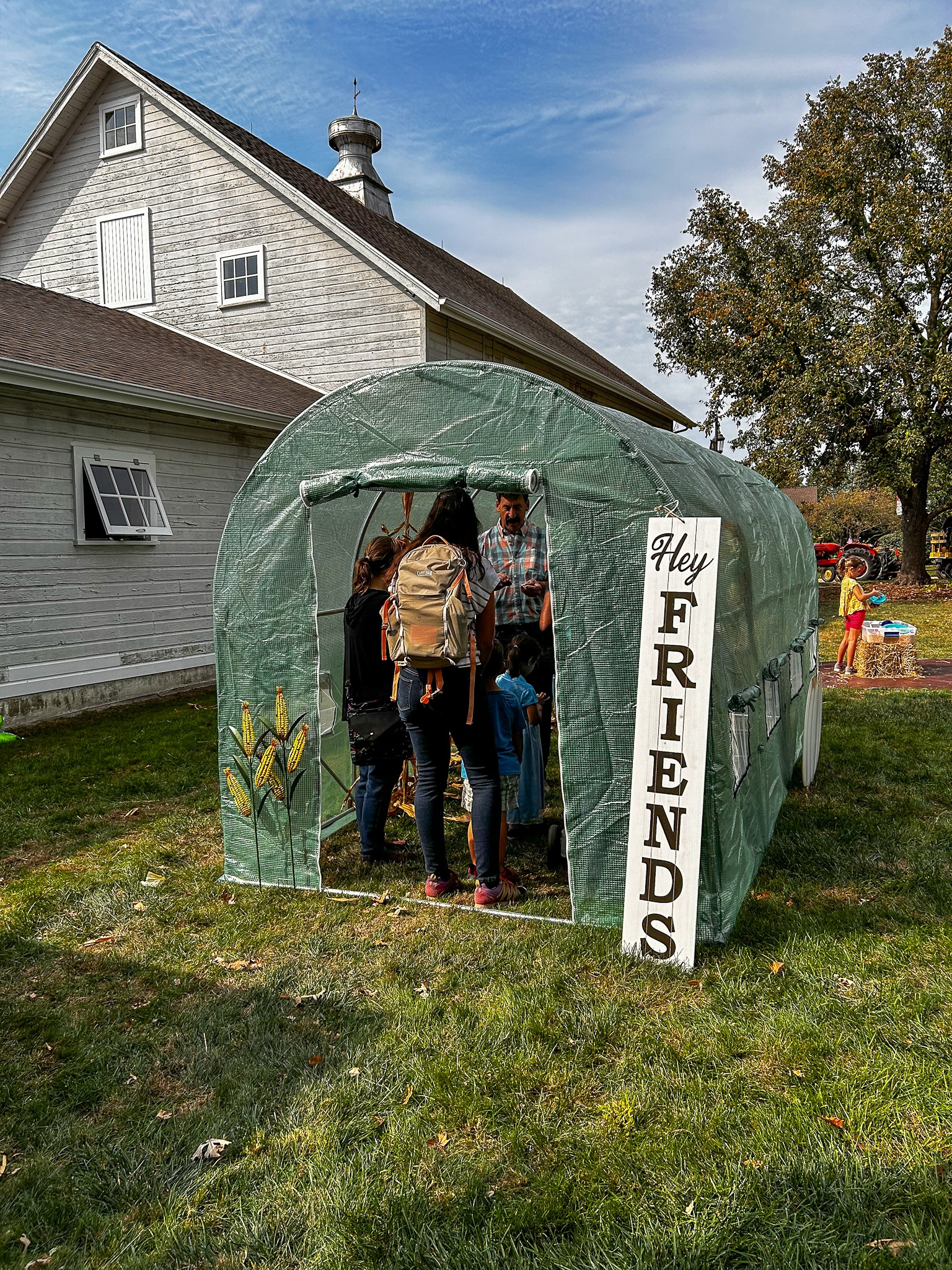 Visitors entering a decorated friends of danada fall activity area
