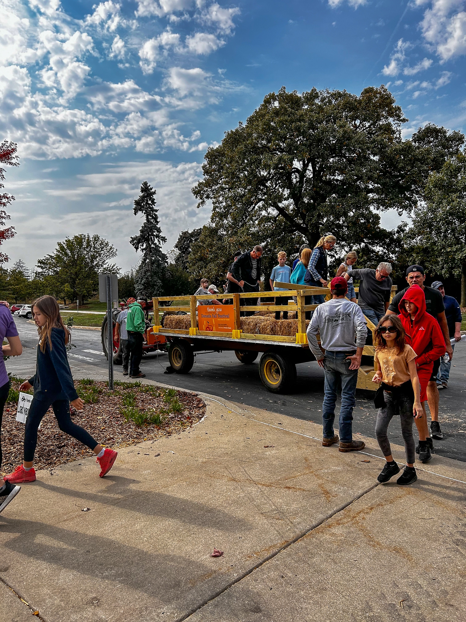 Visitors boarding a tractor-drawn wagon during a previous fall festival at danada