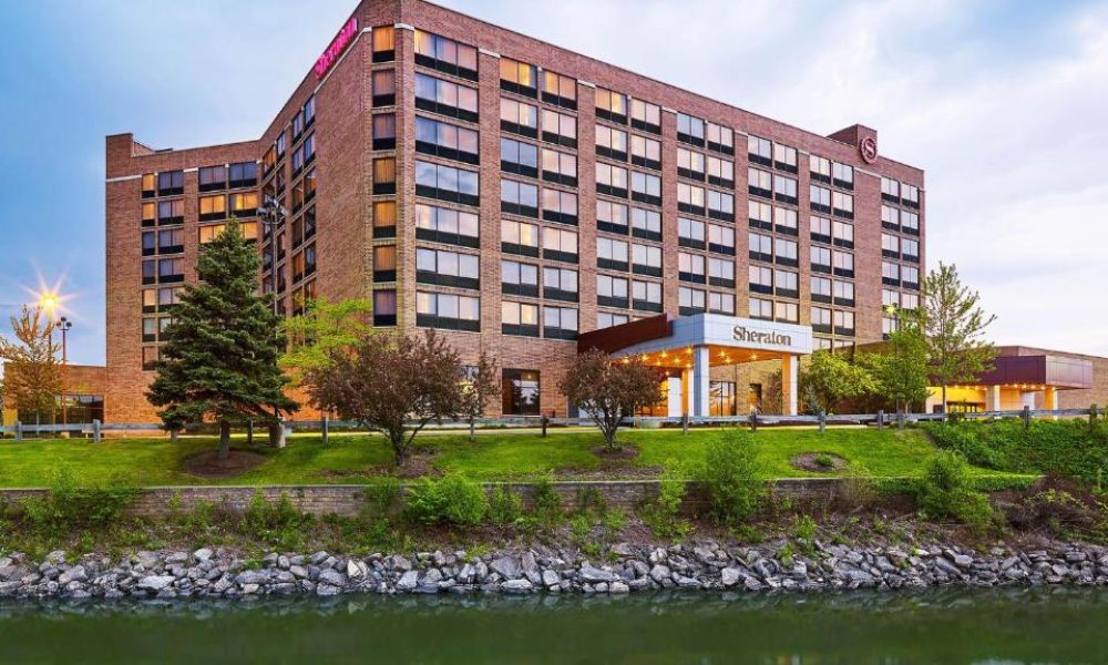 Sheraton Inn Hotel surrounded by a lake